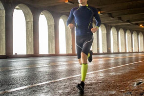 Runner wearing txg calf compression sleeves