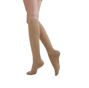Female model wearing classic medical compression socks in beige colour by TXG Australia