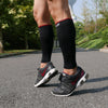 Male runner wearing txg calf compression sleeves