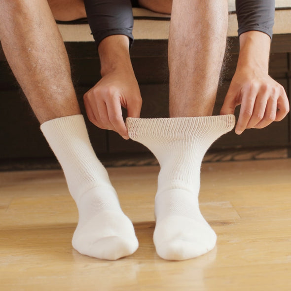 Male model wearing txg diabetic cushion socks