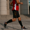 Male runner wearing TXG calf compression sleeve in black